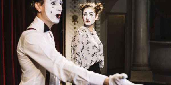 angry-female-mime-artist-looking-male-mime-presenting