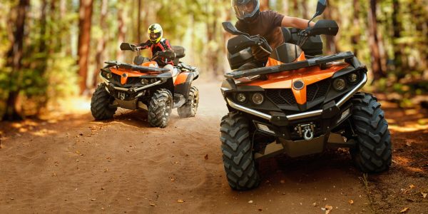 two-atv-riders-helmets-speed-race-forest-front-view-riding-quad-bike-extreme-sport-travelling-quadbike-offroad-adventure